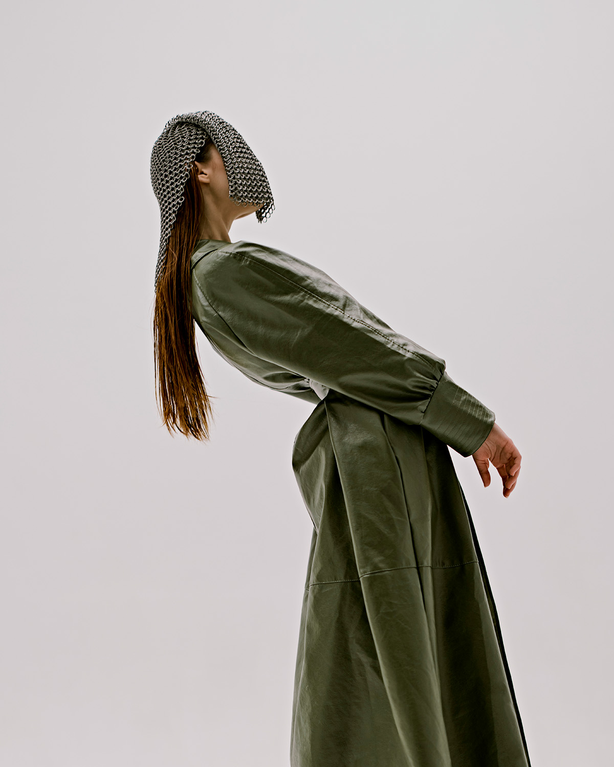 attractive woman green coat with chain mail his head lifestyle unaltered 1